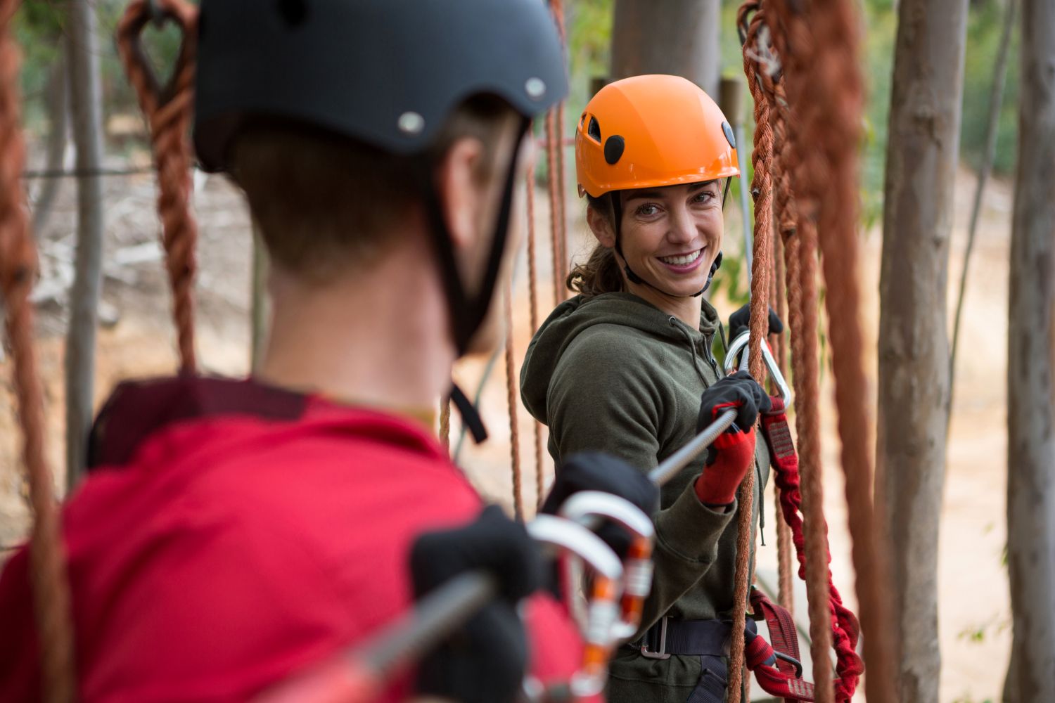 Participating in adventure course activities