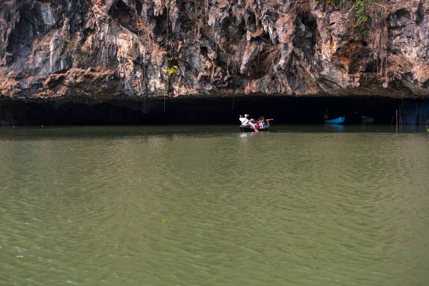 Take a boat ride through a cave.